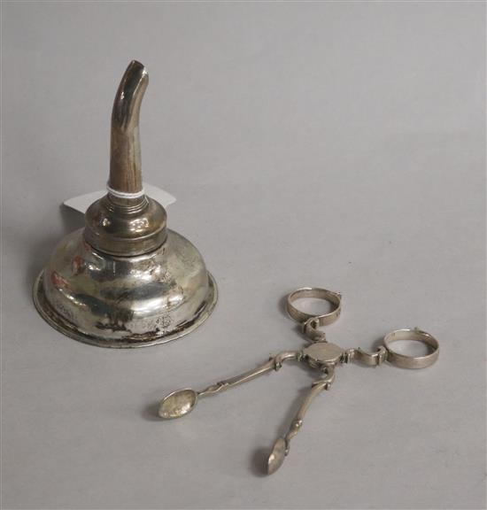 A George III Irish silver wine funnel, Dublin, 1818? and a pair of mid 18th century silver sugar nips.